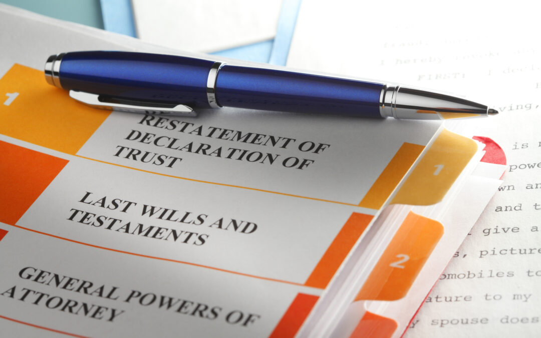 A blue ballpoint pen rests on top of trust documents.